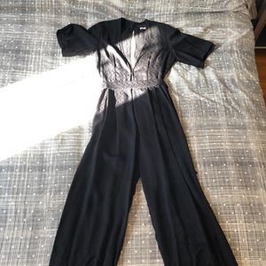 Reformation black silk jumpsuit size 6.